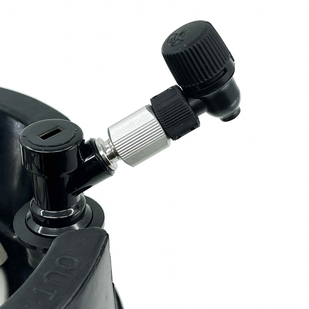Close-up of the Picnic Tap 2.1 - Homebrewer LAB: a black and silver metal valve with two black plastic knobs and built-in flow-control, mounted on a curved black surface.