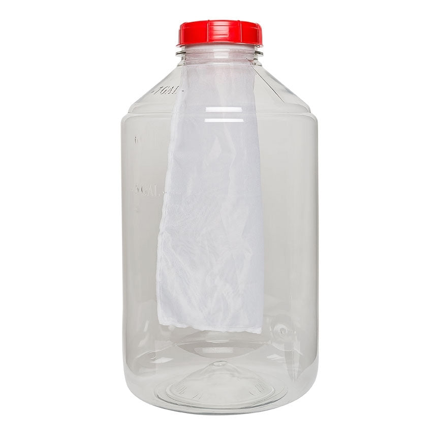 I en gjennomsiktig plastkrukke med rødt skruelokk henger The Vintage Shops MonsterMesh-filter til FerMonster (300 mikron).