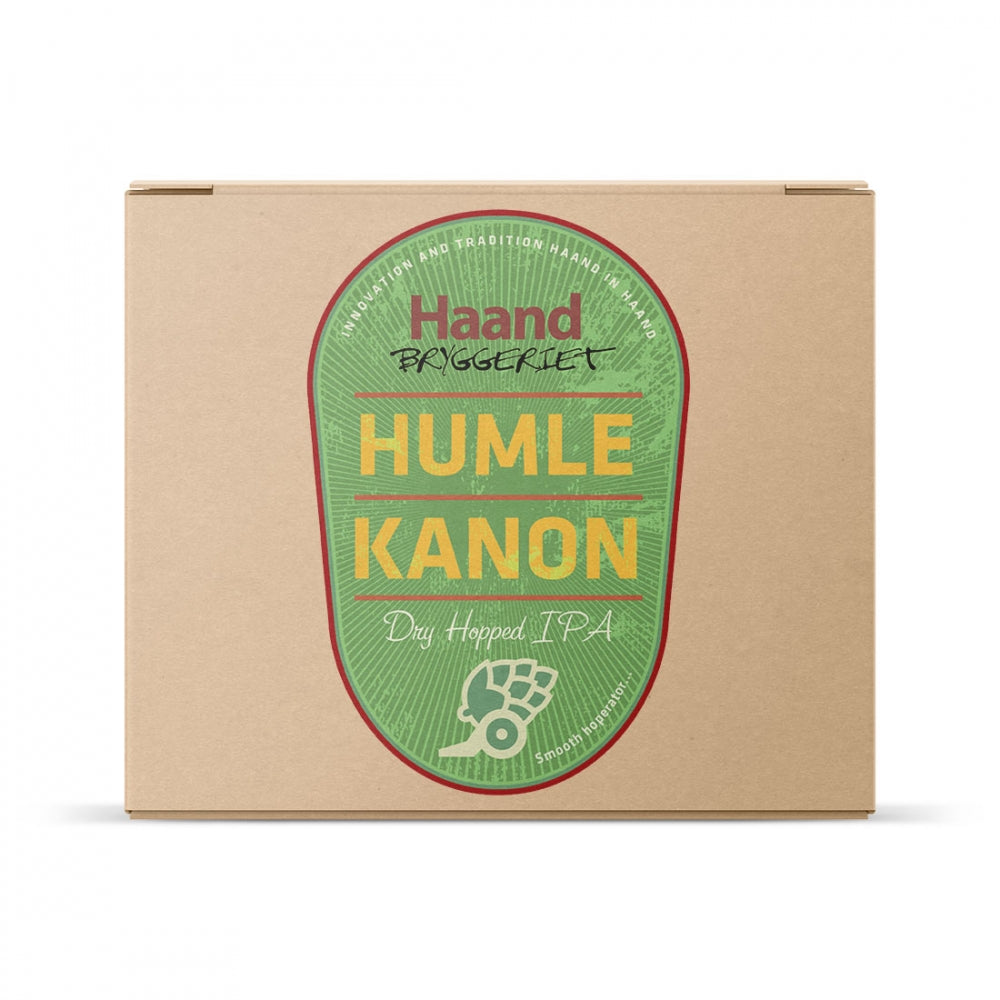 En pappeske fra Brewshop, merket Haandbryggeriet Humlekanon - allgrain ølsett med et grønt og oransje ovalt design og en liten humlegrafikk, perfekt til hjemmebrygging.