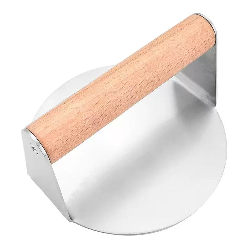 Round stainless steel smash burger press with wooden handle, seen at an angle from above