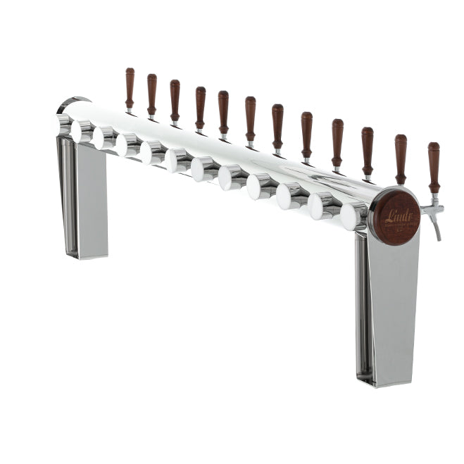 Lindr Naked Cold Bridge 12 Tappetårn er en elegant, polert dispenser i rustfritt stål med tolv spaker med trehåndtak på rad over to rektangulære støtter, og er utstyrt med Cold Bridge-kjøling for å sikre optimal drikketemperatur.