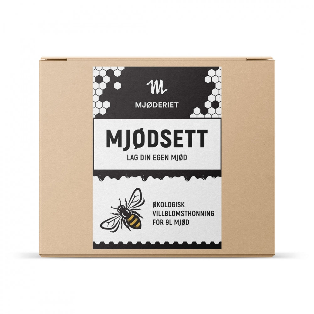En pappeske merket Mjøderiet Mjødsett for bringebærmjød, med bie- og bikakemotiv, er et økologisk mjødmaker-sett fra Mjøderiet som gjør det mulig å lage 9 liter klassisk honning- eller delikat bringebærmjød hjemme.
