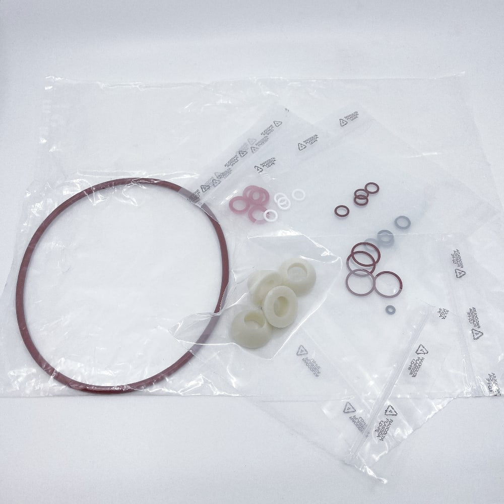 Komplett sett med pakninger til Enolmaster fra Tenco, med ulike gummi- og plastpakninger i forskjellige størrelser - ideelle erstatninger for Enolmaster-kolbefylleren din.