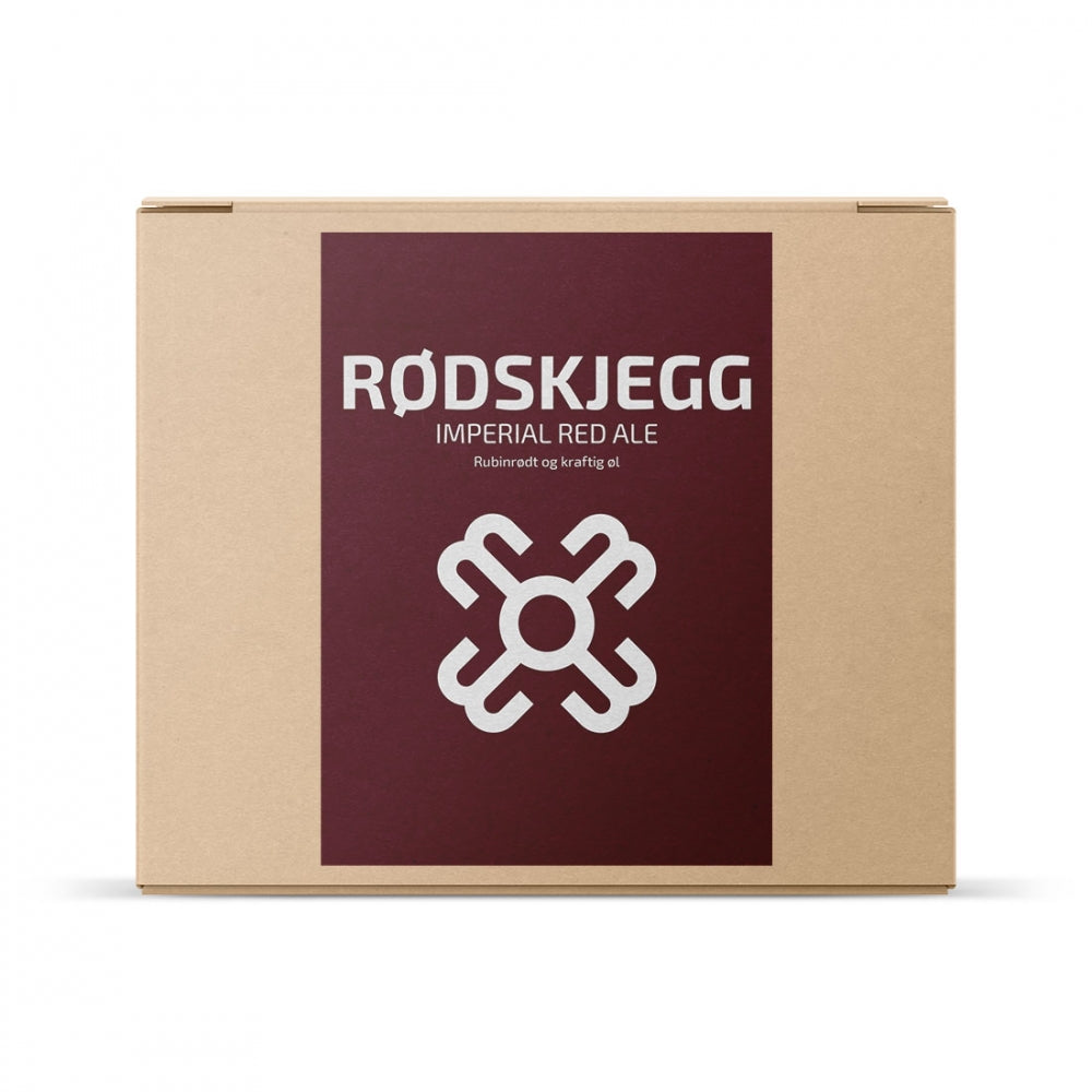 En pappeske merket "Rødskjegg Imperial Red Ale" med en hvit geometrisk logo inneholder Brewshop Hogna Brygg Rødskjegg Imperial Red Ale allgrain ølsett for hjemmebrygging av din egen kraftige Imperial Red Ale.