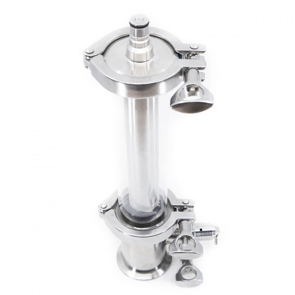 Brewtools Inline Filter Kit, 2" TC m/Ball Lock, er et sylindrisk filterhus i rustfritt stål og glass med klemmer og porter, ideelt for ølfiltrering eller bruk med gjæringstankfilter. Avbildet mot en hvit bakgrunn.