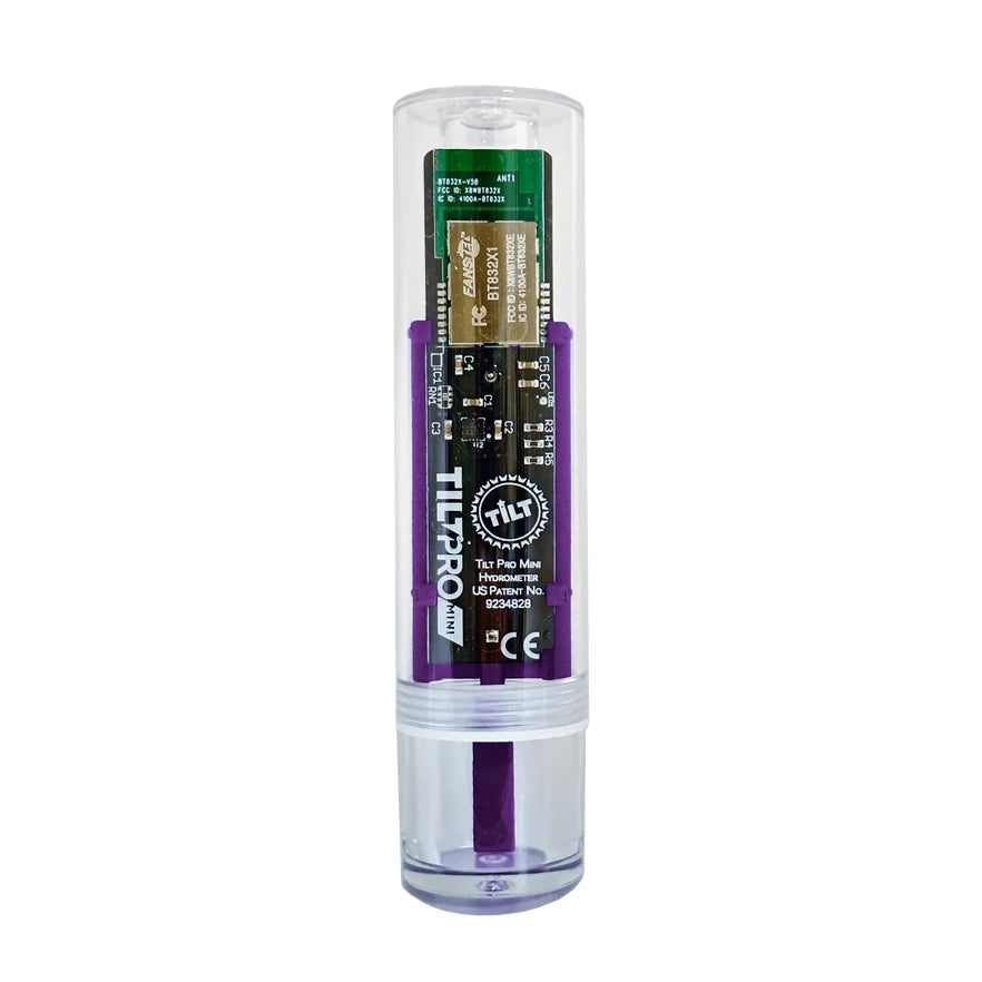The Tilt Pro Mini Hydrometer & Termometer for hjemmebrygging comes in a clear cylindrical case with a white cap and purple base, showing its internal circuit boards and electronic components.