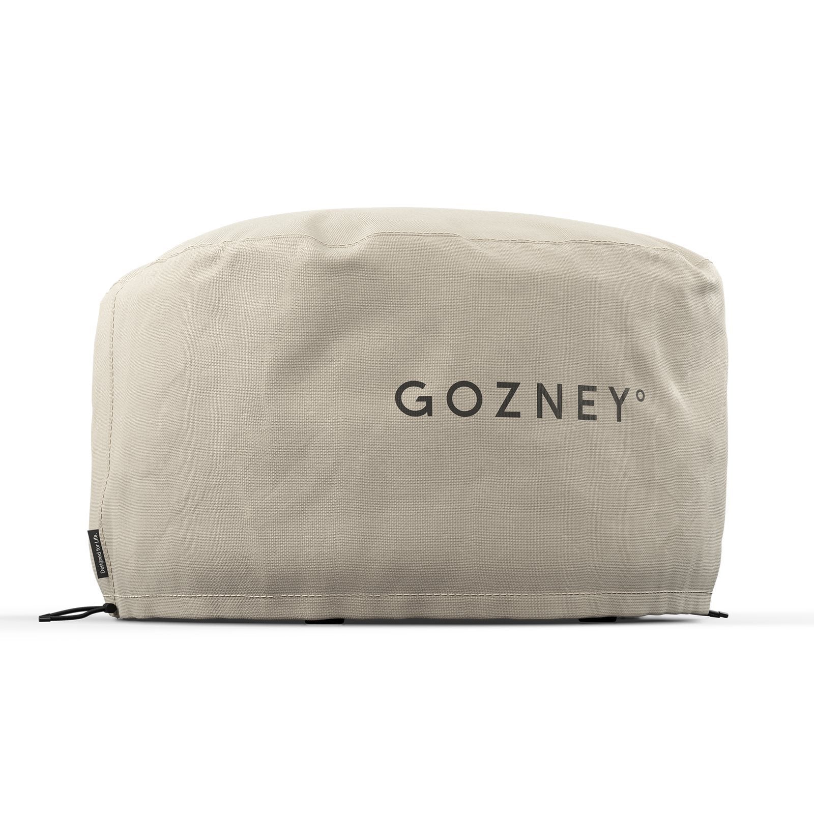 Gozney Arc XL Trekk er et beige stofftrekk med "GOZNEY" på forsiden, designet for å passe til og beskytte din Gozney pizzaovn. Vist montert over et rektangulært objekt mot en hvit bakgrunn.